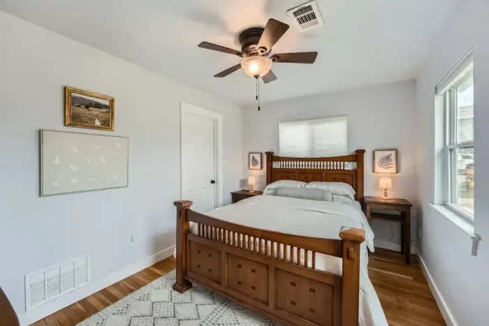 Classic comfort, wood accents, bright windows, and a comfy bed for sweet dreams.