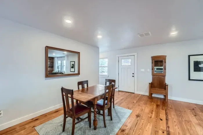 Gather around the dining table for family meals, game nights, or morning coffee in this bright and welcoming space.