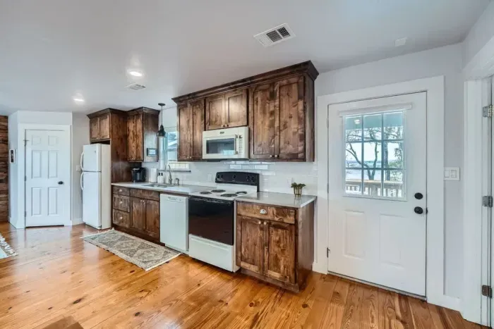 Enjoy family meals or casual snacks in this well-appointed kitchen with plenty of natural light.