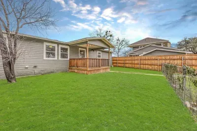Fenced backyard with amazing sunsets overlooking southwestern university and downtown