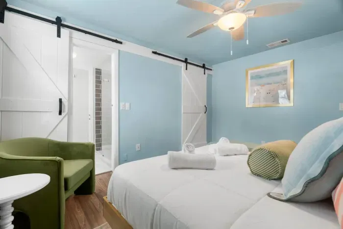 Enjoy a spacious king-size bed and modern decor in this sleek, contemporary room designed for ultimate relaxation.