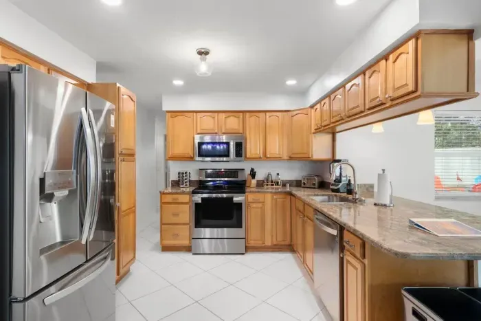 Gorgeous white kitchen with subway tile backsplash and stylish accents to inspire your meals.
