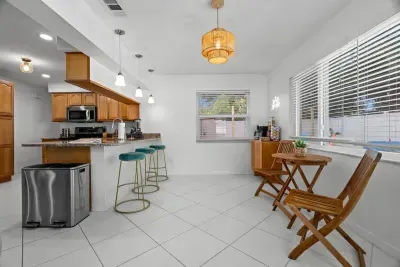 A bright, open-concept kitchen flows seamlessly into the dining area for effortless entertaining.