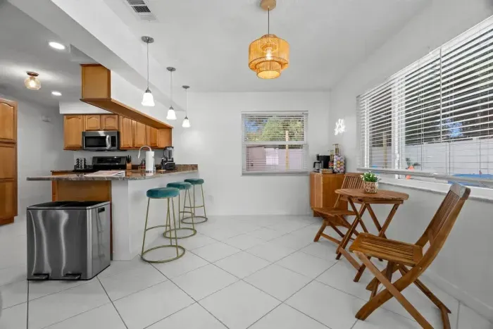 A bright, open-concept kitchen flows seamlessly into the dining area for effortless entertaining.