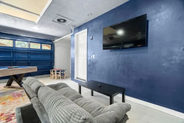 Equipped with a large TV, cozy seating, and space for everyone.