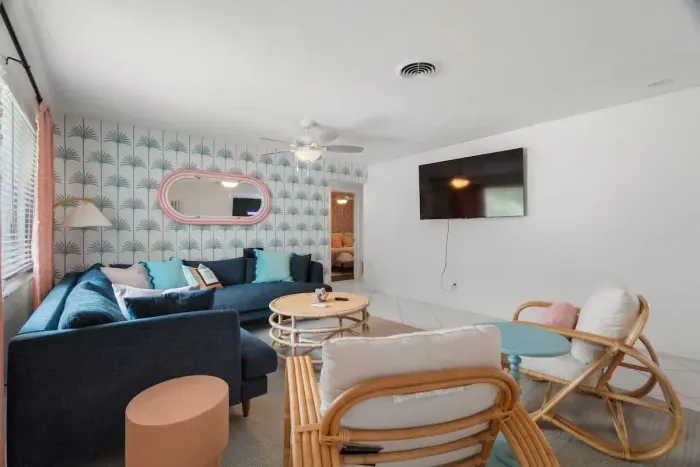 Spacious and bright living room with large windows and serene views.