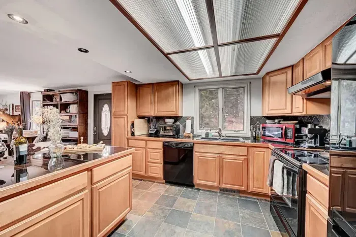 Another kitchen view showing modern features and cabin-style details for a true retreat feel!
