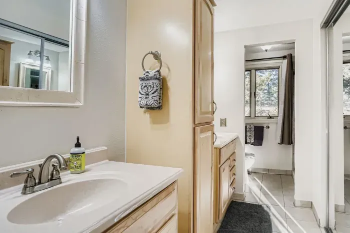 Updated ensuite featuring granite counters and a spa-style design.