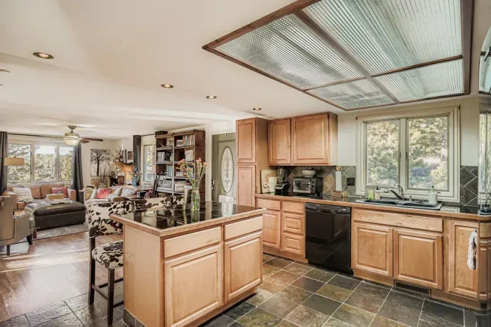 Bright kitchen featuring ample storage and a welcoming breakfast area.