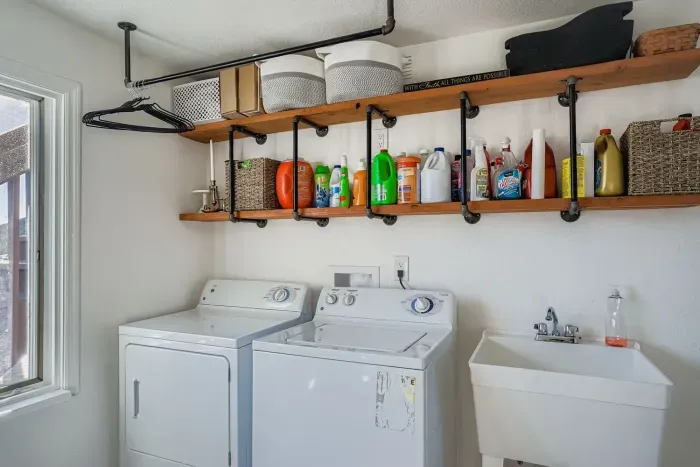 Laundry room with washer, dryer, and plenty of storage space.