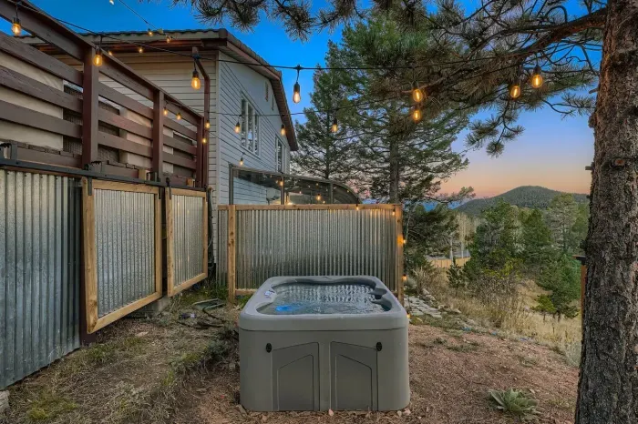 Private hot tub with stunning views and evening sky above.