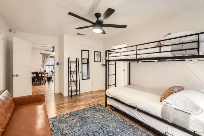 Guest-friendly bedroom with a cozy vibe and ample storage space.