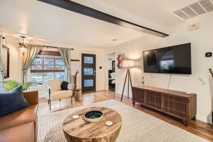 Cozy living room with plush seating and a large TV for movie nights or relaxing afternoons.