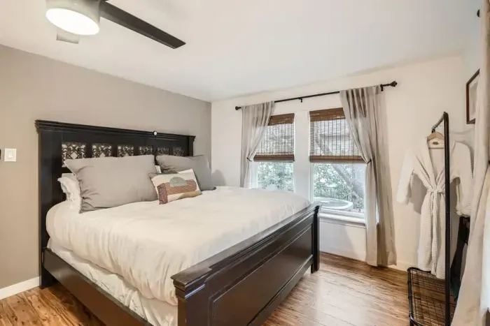 Sleep like royalty in this spacious bedroom with a king-size bed and chic, contemporary decor.