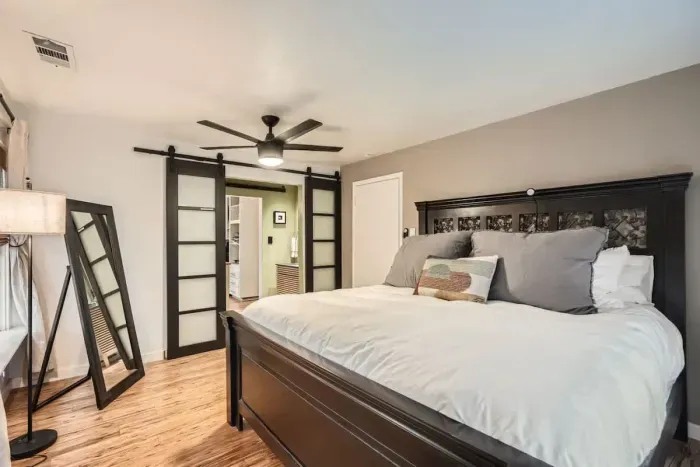 Sleep like royalty in this spacious bedroom with a king-size bed and chic, contemporary decor.