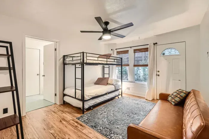 Guest-friendly bedroom with a cozy vibe and ample storage space.