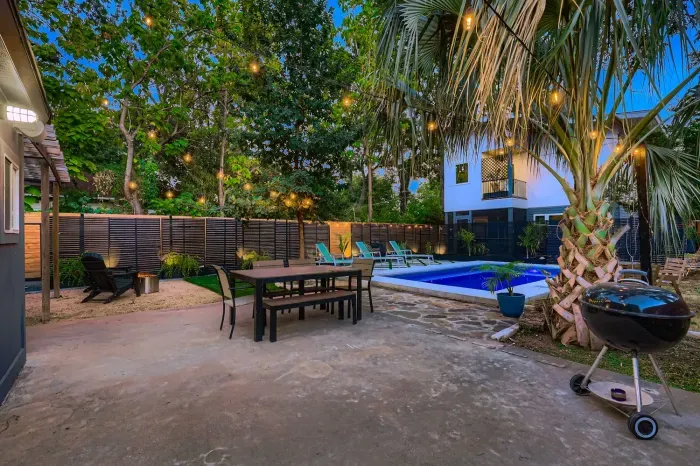 Outdoor dining area with firepit for cozy evenings.