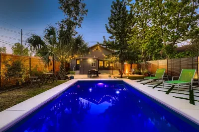 Sparkling evening poolside with plenty of space to relax.