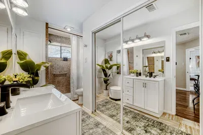 Extended vanity with ample storage and walk in shower space designed for ease and convenience