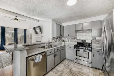 Updated kitchen with stainless steel appliances and open layout that keeps you connected to the living space