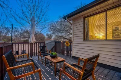 Private deck at dusk with cozy seating for evening conversations