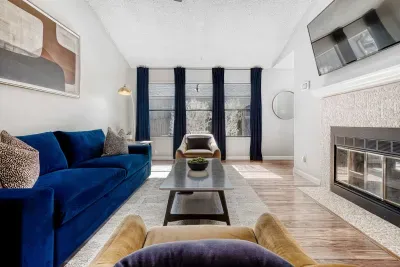 Modern comfort meets clean design, sink into the velvet sofa and unwind beside the fireplace.