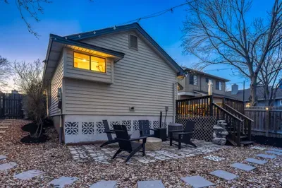 Spacious backyard with multiple seating areas for gathering and relaxing