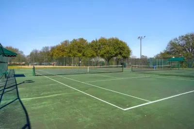 Lighted tennis courts for daytime matches or evening play