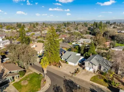 Quiet residential area with tree-lined streets and nearby amenities.