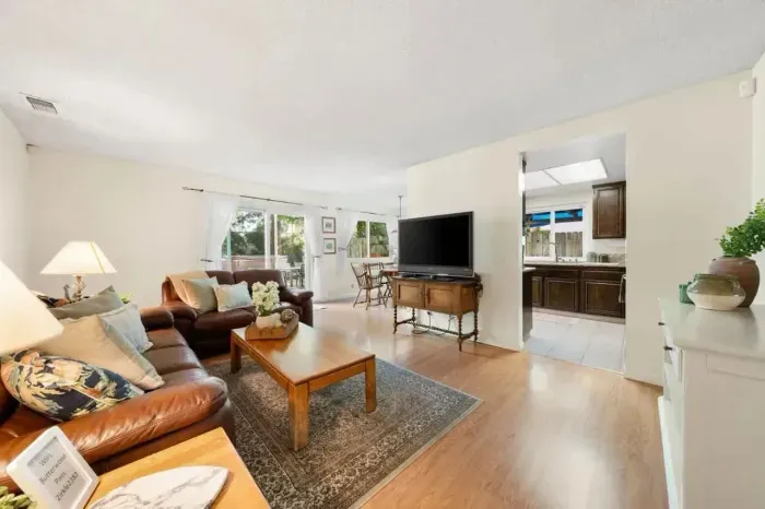 Seamless flow between living, dining, and kitchen areas.