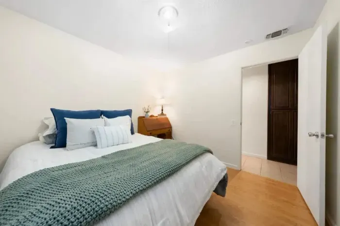 Comfortable sleeping space with warm tones and uncluttered design.