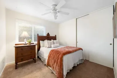 Cozy bedroom with soft linens, natural light, and a calm atmosphere for restful sleep.