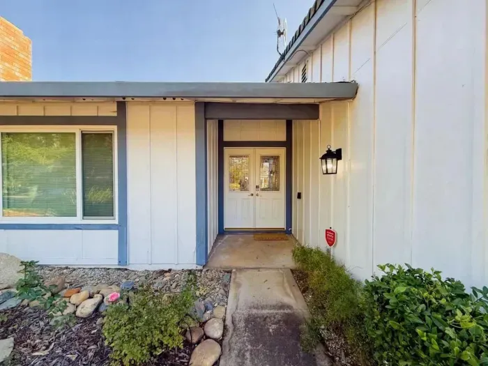 A clean, well-maintained path leading directly to the front door.