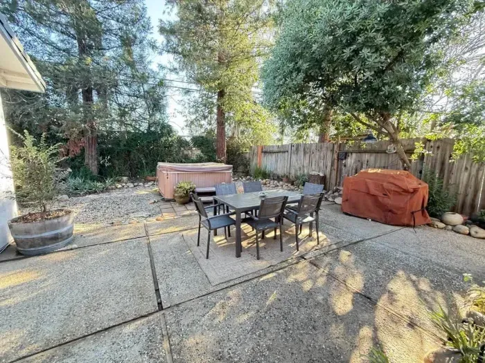 Peaceful outdoor area surrounded by mature trees for privacy and relaxation.