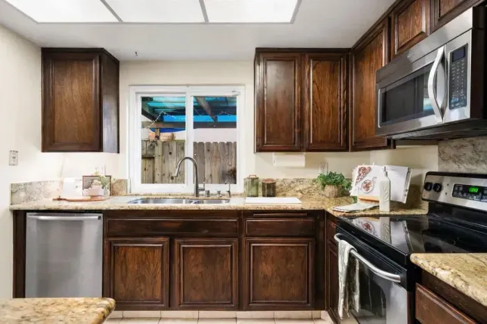 Seamless layout connecting the kitchen to the dining area for easy hosting and gathering.