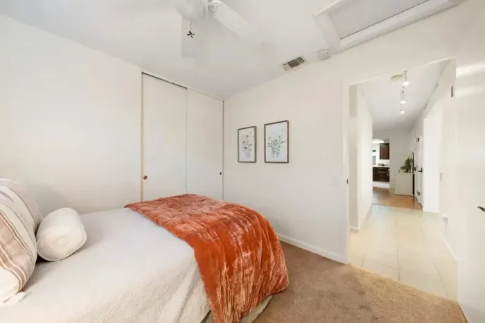 Cozy bedroom with soft linens, natural light, and a calm atmosphere for restful sleep.