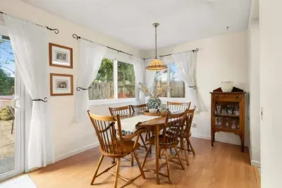 Bright dining space perfect for meals, games, or remote work.
