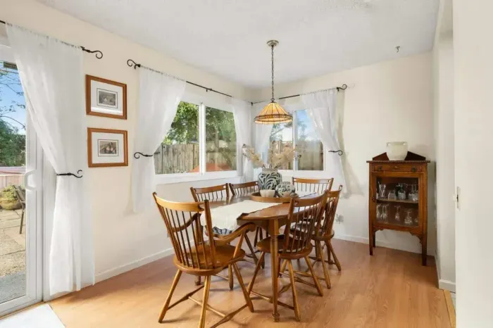 Bright dining space perfect for meals, games, or remote work.