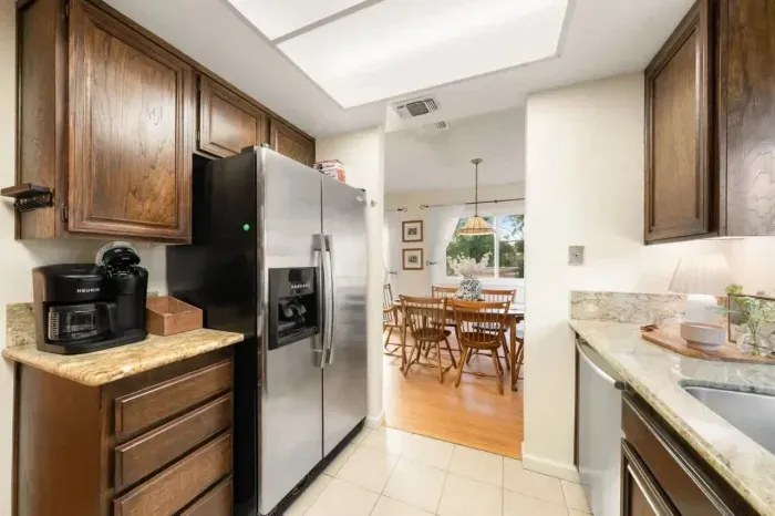 Open kitchen with modern appliances, ample counter space, and everything needed for home-cooked meals.