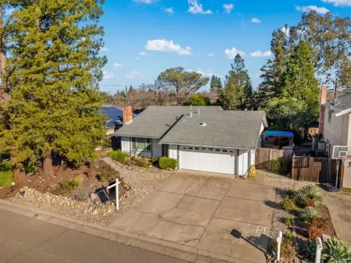 Clear layout of the home and backyard within a peaceful neighborhood.