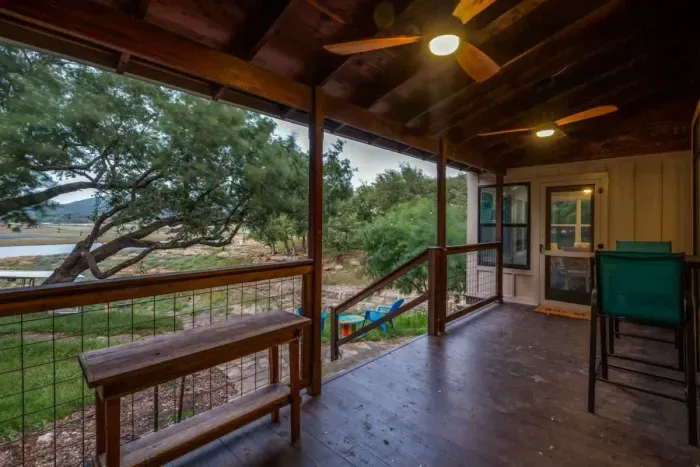 Inviting patio with plenty of seating and beautiful greenery, creating a serene outdoor retreat.