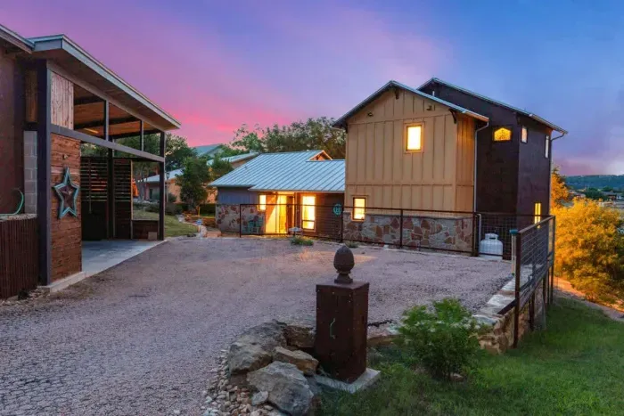 Stunning exterior with a combination of natural stone and warm wood accents.
