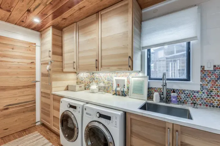 Spacious laundry room with washer and dryer for your convenience.