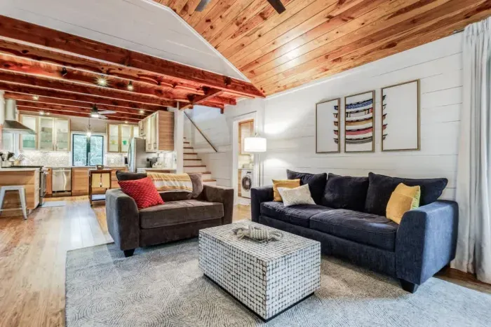 Spacious living area with comfortable couches, perfect for gathering with friends and family.