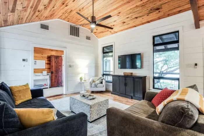 Equipped with a large TV, cozy seating, and space for everyone.