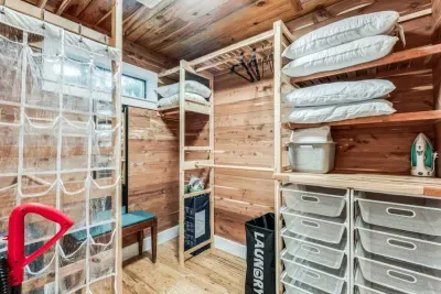 Step into the spacious primary closet, featuring tons of storage with custom shelving, racks, and drawers. Ample space ensures all your clothing and accessories are neatly organized and easily accessible.