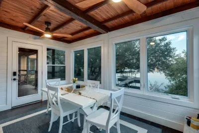 Dining nook surrounded by panoramic windows and scenic views.