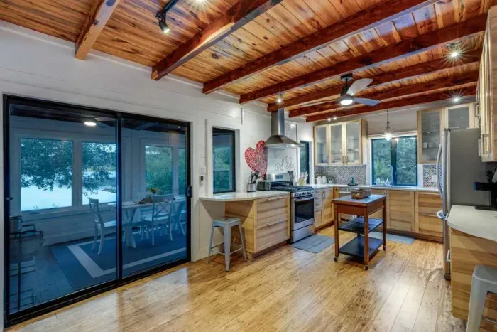 Open-concept kitchen and dining area with lake views.