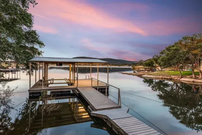 Private dock with access to the lake at sunset.