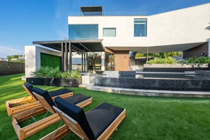 Gorgeous backyard with a sparkling pool, perfect for sunbathing and swimming.